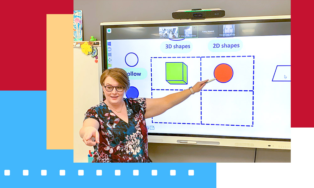 woman teaching using interactive panel